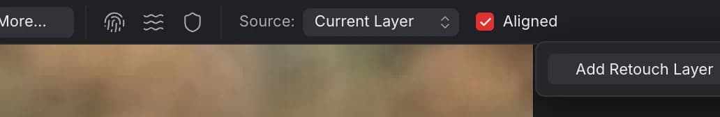 The right end of the Clone Brush toolbar: Source: Current Layer, Aligned checked, and the ⋯ menu open with Add Retouch Layer