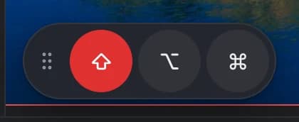 The modifier keys: a dotted drag handle and round ⇧, ⌥ and ⌘ buttons, with ⇧ highlighted in red because it's turned on